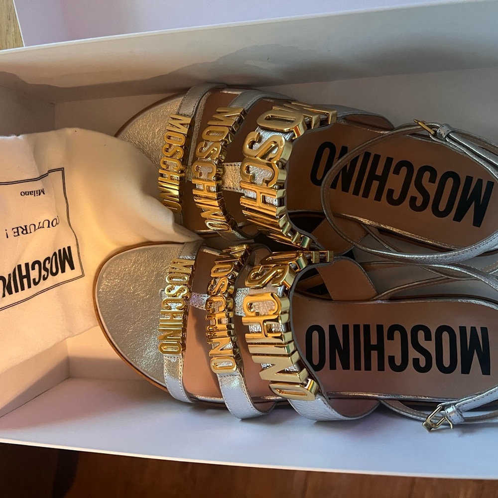 Moschino Metallic Silver Sandals with Gold Lettering
